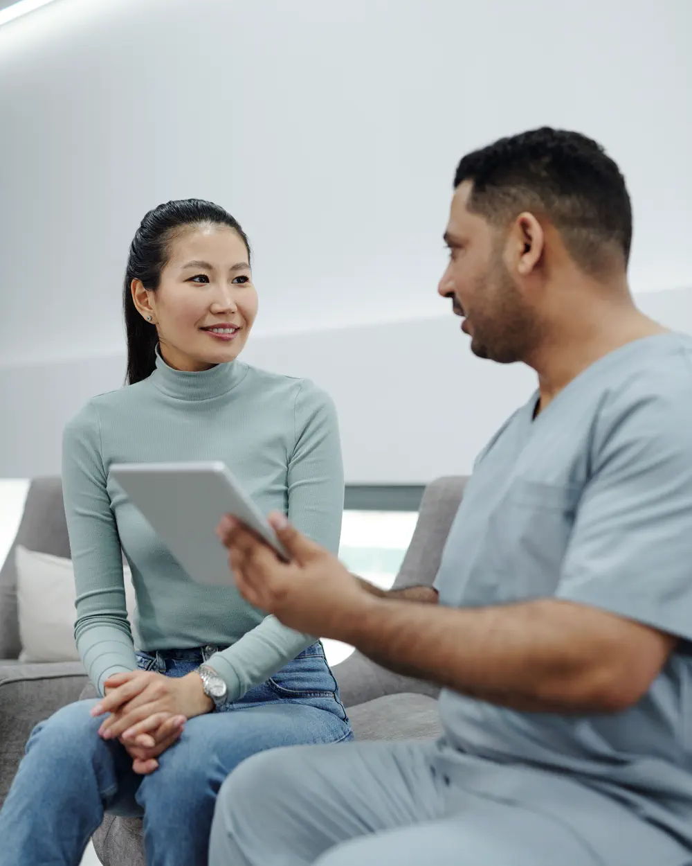 Adult speaking with a healthcare professional during a consultation